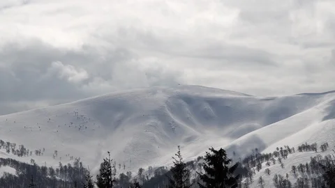 Passing Clouds Cast Shadows On Snow Capped carpathian mountains time lapse Stock Footage 87876693