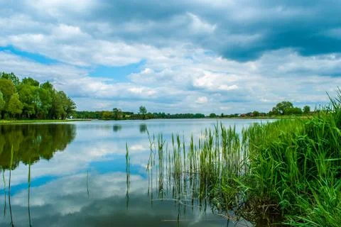 Passing clouds over lake Stock Photos
