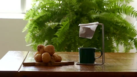 Passing coffee through a strainer and hot cheese bread Stock Footage 230465574