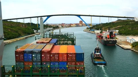 Passing of containers vessel with own crane under Queen Juliana Bridge Stock Footage 243515036