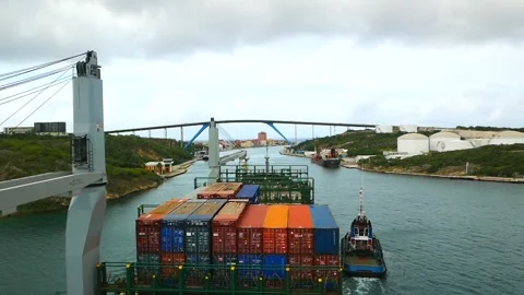 Passing of containers vessel with own crane under Queen Juliana Bridge Stock Footage 243515037