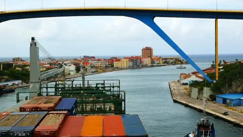 Passing of containers vessel with own crane. under Queen Juliana Bridge Stock Footage 243515046