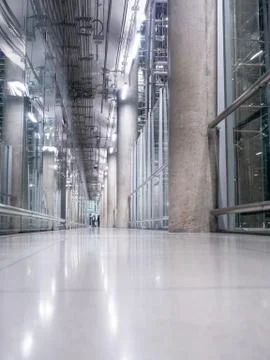 Passing daylight inside office building on modern glass building interior cor Stock Photos