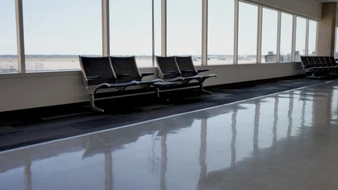 Passing empty chairs at the airport Stock Footage 129277114