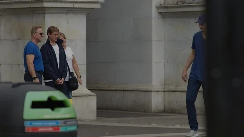 Passing football back and forth as people watching, Marble Arch. Stock-Footage 93210487
