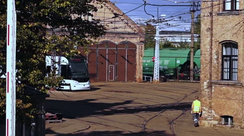 Of passing freight train composition to the old tram depot background Video stock 55758103