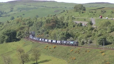 Passing Freight Trains and M6 Motorway in the Lune Gorge Video stock 83532339