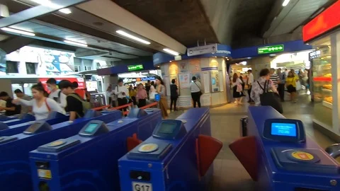 Passing the gate to the skytrain in Bangkok 스톡 동영상 106437768