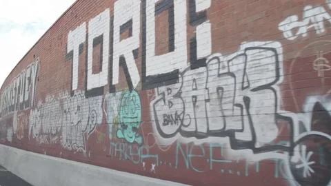 PASSING GRAFFITI WALL Stock Footage 75947870