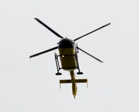 Passing helicopter seen from below Stock Photos