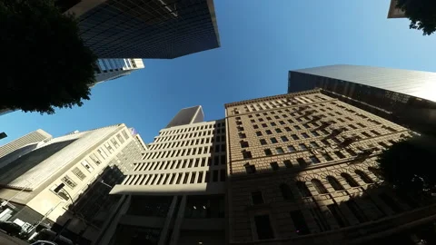 Passing high-rise buildings in Down Town on a sunny day Stock Footage 235657819