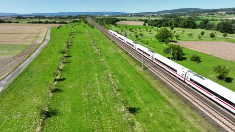 A passing highspeed train - aerial view Video stock 247662556
