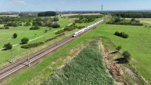 A passing highspeed train - aerial view Видео 247663137