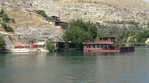 Passing hithe restaurant approaching to the old Halfeti town Stock Footage 159119966
