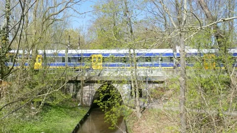 Passing local train, old railroad bridge, Blumenthal, Bremen, Germany, Europe Video stock 154625664