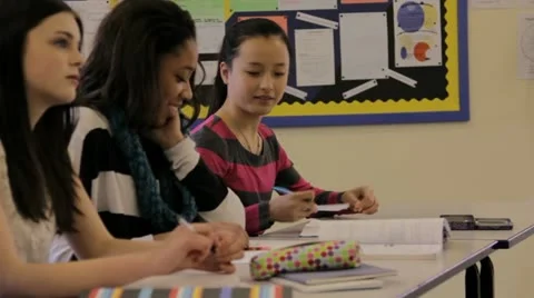 Passing a note in class Stock Footage 22664955
