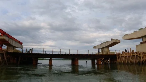 Passing by old bridge during a boat ride on an evening, Kerala, India 動画素材 122573146