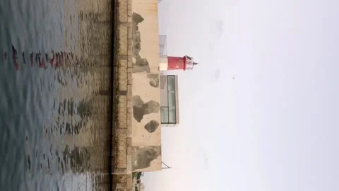 Passing by old light house on boat Stock Footage 157222687