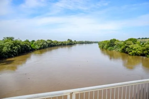 Passing over the bridge over river. The landscape of the river, the surface a Stock Photos