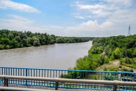 Passing over the bridge over river. The landscape of the river, the surface a Stock Photos