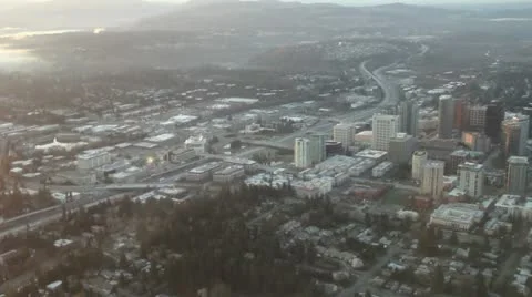 Passing Over Small City at Sunset Stock Footage 10995039