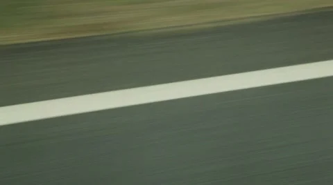 Passing over white line road markings on road Stock Footage 52126606