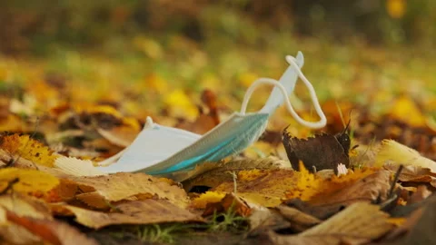 A passing person accidentally drops or deliberately throws away a medical Stock Footage 146690113