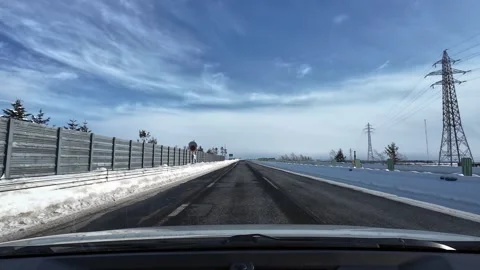 Passing power transmission tower on winter highway in Hokkaido Stock Footage 333229939