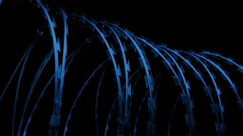 Passing Razor Wire Barrier In The Dark Stockbeeldmateriaal 176912604