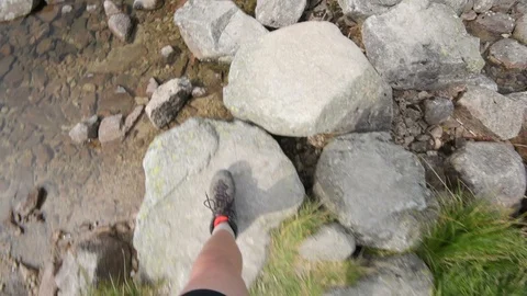 Passing a river on a mountain trail in the Tatra Stock Footage 94116417