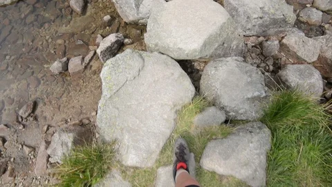 Passing a river on a mountain trail in the Tatra Stock Footage 94117164