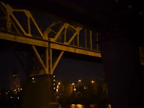 Passing the river railway bridge at night Stock Footage 71862613