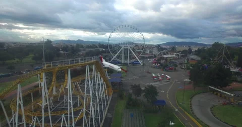 Passing by roller coaster and over the ferris wheel of Salitre Magico Stock-Footage 66597158