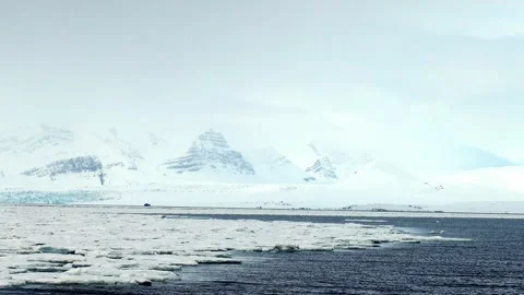 Passing Sea Ice in Arctic Waters Near Svalbard Stock Footage 339277576