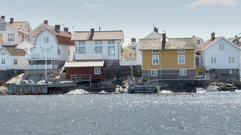 Passing by a set of seaside cabanas. 스톡 동영상 119738221
