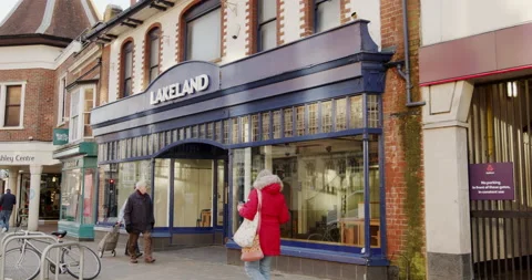 Passing shoppers notice the shops closure of British kitchenware chain Lakeland. Stock Footage 147625375