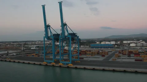 Passing shot of cranes at port Stock Footage 36778437