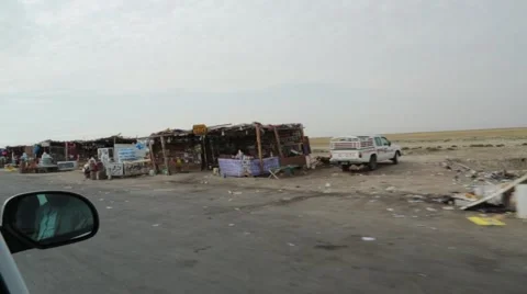Passing Shot of Makeshift Dukas (Shops) Along Iraqi Highway Stock Footage 42955636