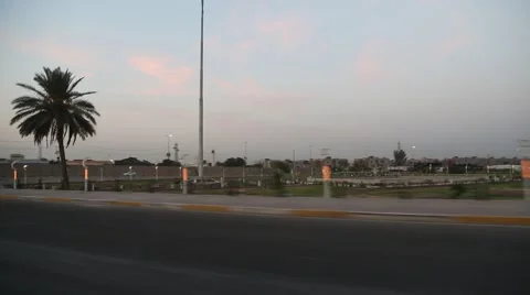 Passing Shot of Palm Tree and Streets of Basra, Iraq Stock Footage 42953910