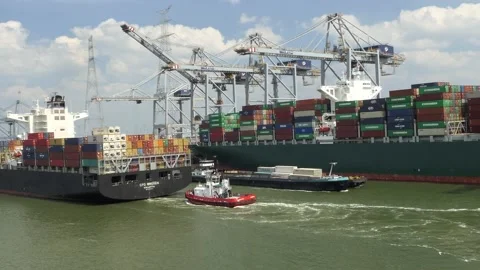 Passing small and large ship in the port of Antwerp. Stock Footage 131464458