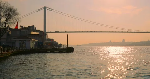 Passing small boat and ferry port at the back, İstanbul Stock Footage 127872133