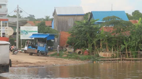 Passing Southeastern Asian ferry terminal with local ambiance Stock Footage 130644723