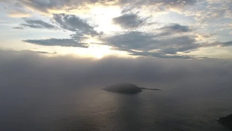 Passing through the clouds and observing islands and sea. Stock Footage 81136331