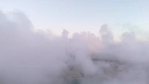 Passing through clouds at sunrise over the sea, the camera captures beautif.. Stock Footage 286054929