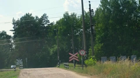 Passing through a railway crossing in the forest. Summer. rural road Stock Footage 273697109