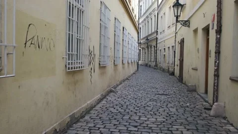 Passing Through The Stone Street Between The Buildings. Stock Footage 221187866