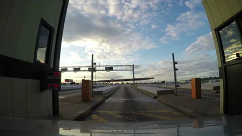 Passing through a toll gate ticket point or gate on a motorway Stock Footage 153262131