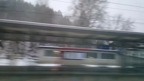 Passing through a train station in a snow storm in Austria Video stock 84929734