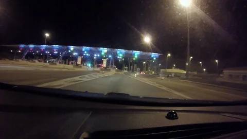 Passing from the toll booth during night Stock Footage 127968142
