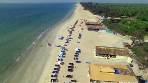 Passing by the tourists on the beach Stock Footage 83221280